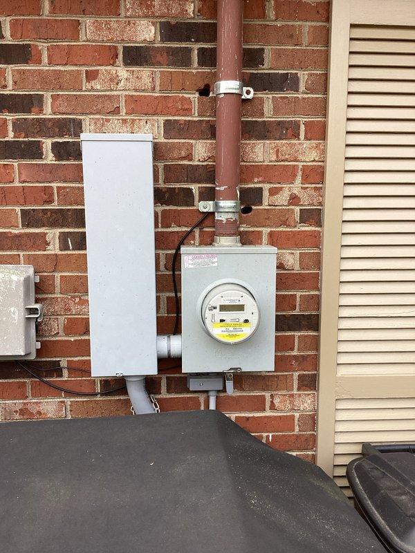 Conducted comprehensive electrical estimate for generator installation at residential property. Evaluated existing electrical infrastructure including main service panel, meter base, and exterior utility connections mounted on brick wall exterior. Assessed current electrical service capacity and determined optimal routing for generator connection conduit. Documented existing weathered outdoor plumbing fixtures and utility equipment locations to plan appropriate clearances and code-compliant placement for standby generator system. Photographed site conditions including brick wall mounting surfaces, existing conduit runs, and ground-level access points to develop accurate material list and labor requirements for complete automatic transfer switch installation and generator pad preparation.