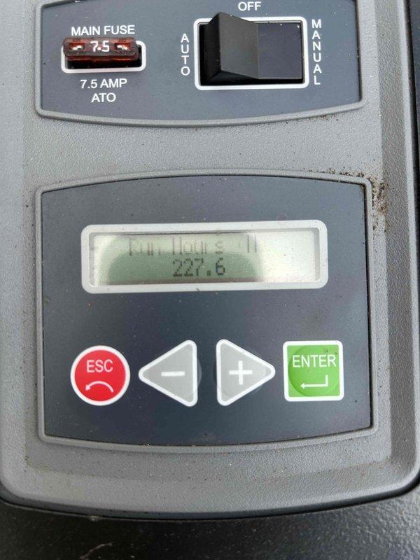 Completed routine preventive maintenance on Carrier residential standby generator. Performed visual inspection of unit exterior and internal components, verified main 7.5 AMP fuse condition, confirmed proper control panel operation with LCD display showing 227.6 run hours, tested auto/manual switch functionality, and ensured unit readiness for automatic operation during power outages.