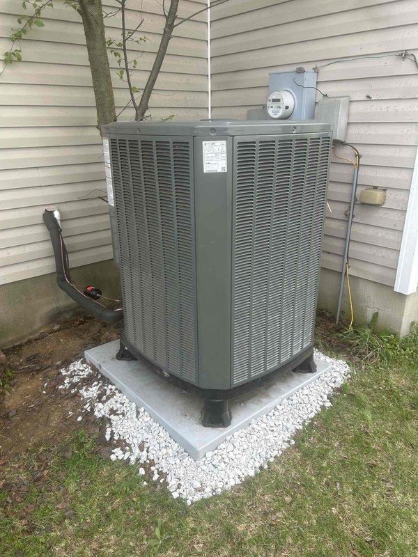 Completed full heat pump system replacement using customer-supplied equipment. Removed existing heat pump system and installed new outdoor condensing unit on existing concrete pad with proper leveling and vibration isolation. Mounted new indoor air handler with secure bracket assembly to structural framing. Ran refrigerant lines from outdoor unit to indoor handler along exterior siding with proper insulation and support. Connected electrical service via existing conduit to outdoor unit. Tested system operation, verified proper refrigerant charge levels, and confirmed all electrical connections meet code requirements. System is fully operational and performing within manufacturer specifications.