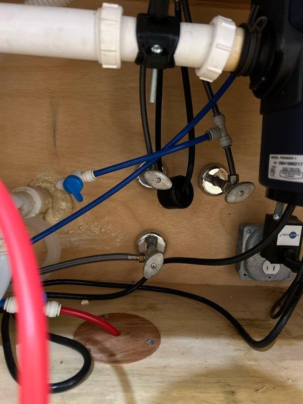 Completed plumbing repair in basement by cutting out and replacing leaking copper pipe section, replaced toilet wax ring to restore proper seal, and installed new reverse osmosis system under kitchen sink with full functionality verification. All water supply lines, shutoff valves, and connections were properly secured and tested for leaks before departure.