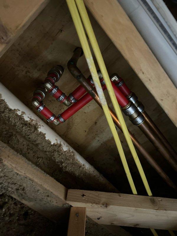 Completed plumbing repair in basement by cutting out and replacing leaking copper pipe section, replaced toilet wax ring to restore proper seal, and installed new reverse osmosis system under kitchen sink with full functionality verification. All water supply lines, shutoff valves, and connections were properly secured and tested for leaks before departure.