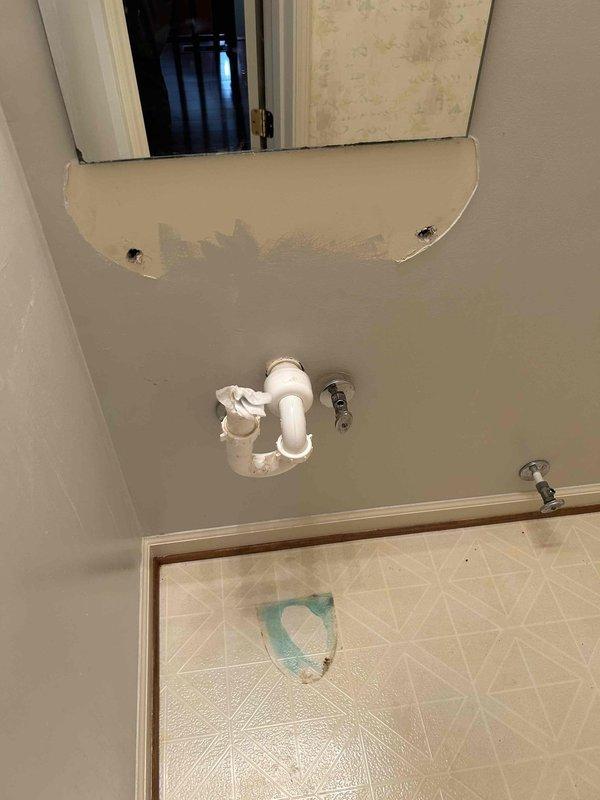 Completed bathroom renovation plumbing work including removal of existing sink and toilet fixtures. Successfully reinstalled customer-supplied toilet with new water supply line connection and angle stop valve, ensuring proper sealing and functionality. Removed and hauled off old toilet fixture from premises as requested, leaving work area clean and ready for continued renovation activities.