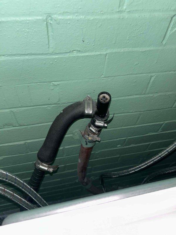 Completed annual tanked water heater maintenance and flush service as part of the USA Bronze preventative maintenance program. Inspected water heater installation in crawl space area, including supply and drain plumbing connections, verified proper pipe support and insulation integrity, and documented existing plumbing configuration with PVC drainage system and copper supply lines. Performed standard water heater flush procedure to remove sediment buildup and ensure optimal performance and efficiency.
