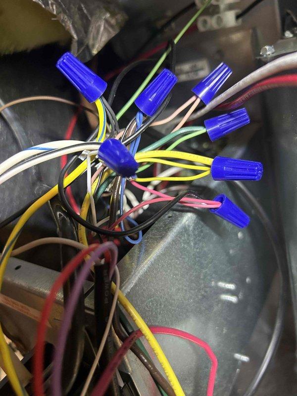 Responded to warranty call for outdoor unit noise complaint. Inspected HVAC system including attic components and outdoor unit electrical connections. Documented system condition with photos showing ductwork, insulation, and control wiring with multiple wire connections secured by wire nuts and capacitor assembly. Awaiting manufacturer approval from Rheem for potential unit replacement per established warranty protocol.
