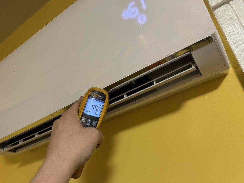 Completed preventive maintenance tune-up on Ameristar mini-split system with four indoor air handler heads. Performed comprehensive inspection of all zones, verified operational temperatures with infrared thermometer confirming proper cooling output at 49.1°F, and documented system performance through diagnostic testing of wall-mounted units.