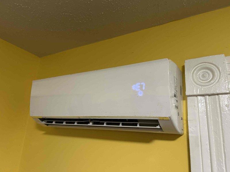 Completed preventive maintenance tune-up on Ameristar mini-split system with four indoor air handler heads. Performed comprehensive inspection of all zones, verified operational temperatures with infrared thermometer confirming proper cooling output at 49.1°F, and documented system performance through diagnostic testing of wall-mounted units.
