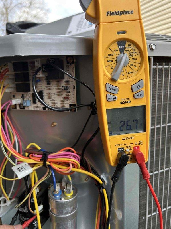 Completed comprehensive preventive maintenance tune-up on dual HVAC system consisting of two heat pumps and two air handlers as part of Care Plan service. Performed electrical diagnostics using calibrated testing equipment, measuring amperage at 26.7A and voltage at 24.65VAC to verify proper system operation and component functionality. Inspected capacitors, relay boards, electrical connections, and condenser coils on both outdoor units to ensure optimal performance and system reliability.