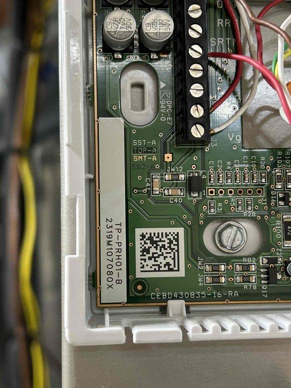 Responded to service call for downstairs HVAC system not operating with E1 error code displaying on thermostat. Inspected control board and electrical connections in basement air handler unit. Verified all wire terminations secure at terminal blocks, checked capacitors and control circuitry for proper operation. Documented control board configuration and wiring connections. System evaluated for any correlation to recent service work performed at property.