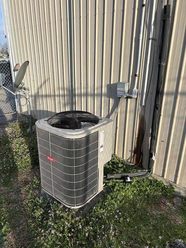 Completed planned maintenance service on Bryant heat pump system located in loft area above offices. Performed comprehensive fall maintenance inspection including temperature diagnostics on supply ductwork, recording 69.0°F at duct surface using calibrated digital thermometer. Inspected insulated ductwork in attic space for proper wrapping and thermal integrity. Conducted exterior inspection of condenser unit, verifying proper installation on concrete pad, checking electrical disconnect, refrigerant line connections, and overall unit condition. System operating within normal parameters with no issues identified during maintenance visit.