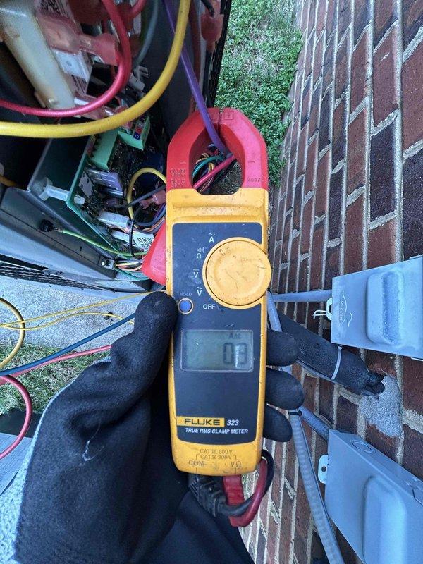 Completed routine AC tune-up on 7-year-old air conditioning system during scheduled maintenance visit. Performed comprehensive system inspection including visual assessment of furnace and mechanical equipment in basement, verified proper air filter installation, and conducted electrical diagnostics on outdoor condensing unit using clamp meter to measure amperage draw and confirm system is operating within manufacturer specifications. All components found to be functioning properly with no issues identified requiring immediate attention.