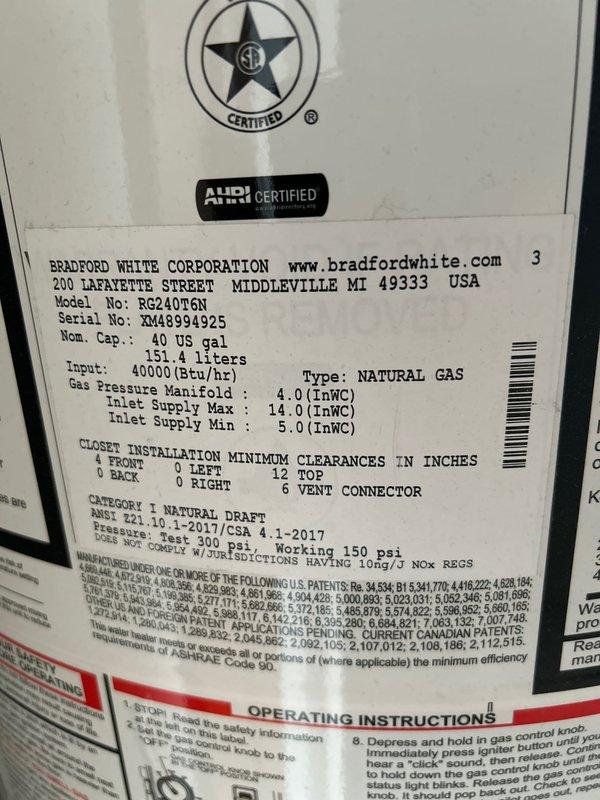 Performed comprehensive maintenance service on Bradford White 40-gallon natural gas water heater, model RG240T6N. Completed full tank drain and flush to remove sediment buildup, as unit had never received previous maintenance despite being in working condition. Inspected and evaluated anode rod condition for potential replacement needs. Examined venting system extending into attic area and assessed condition of vent connector and proper clearance specifications. Verified all plumbing connections, including copper supply lines and flexible gas line connections, for proper operation. Unit operational upon completion of maintenance service.
