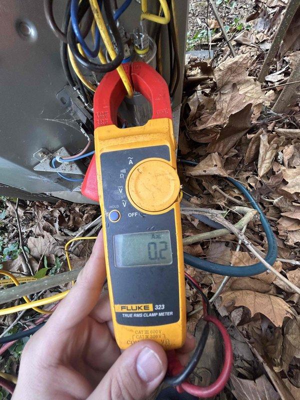 Completed preventive maintenance tune-up on air conditioning system and gas furnace unit located in basement at bottom of steps. Performed comprehensive electrical diagnostics using clamp meter to verify system amperage draw, recording 50 AAC on primary circuit and additional measurements on secondary components. Inspected capacitor and electrical connections, noting all wiring intact with proper terminations. Observed 16x25x1 filter supplied by customer. All electrical measurements within manufacturer specifications, system operating normally upon completion of service.