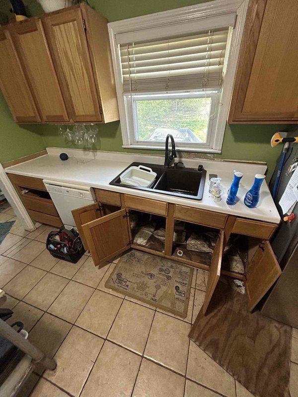 Responded to a water leak under the kitchen sink caused by separated PVC drain pipes in the dual-basin assembly. Reconnected the disconnected drain pipes, secured all connections, and tested the system to ensure proper drainage without leakage. Restored full functionality to the sink and dishwasher drain system.