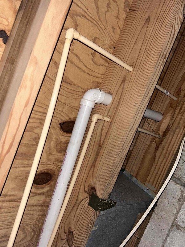 Responded to emergency plumbing service for burst hot and cold water supply lines to garage sink caused by freeze damage. Accessed crawl space and located compromised supply lines. Capped off both the hot and cold water lines and installed shut-off valves for future accessibility and maintenance. Removed the garage sink fixture as requested rather than attempting repair of the damaged lines. All work completed same day to prevent further water damage and restore system integrity.
