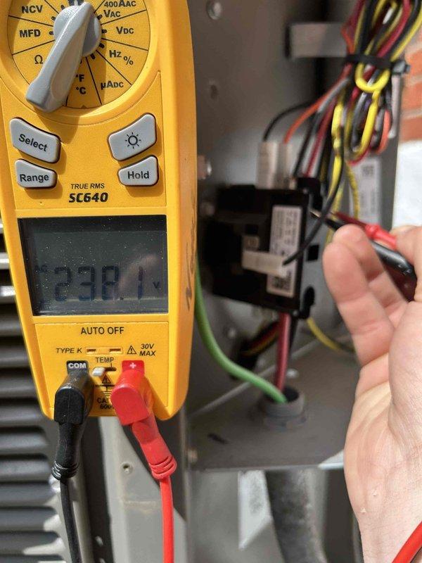Completed comprehensive AC tune-up on 2-year-old air conditioning system as part of scheduled care plan maintenance visit. Performed thorough electrical diagnostics using digital multimeter, recording voltage reading of 23.81V at contactor and relay components to verify proper electrical operation. Conducted temperature measurements with infrared thermometer on refrigerant lines, documenting suction line temperature at 49.1°F to assess system performance and refrigerant charge levels. Inspected all electrical connections, wire bundles, and contactors for signs of wear or damage. System operating within normal parameters with no deficiencies noted at time of service.