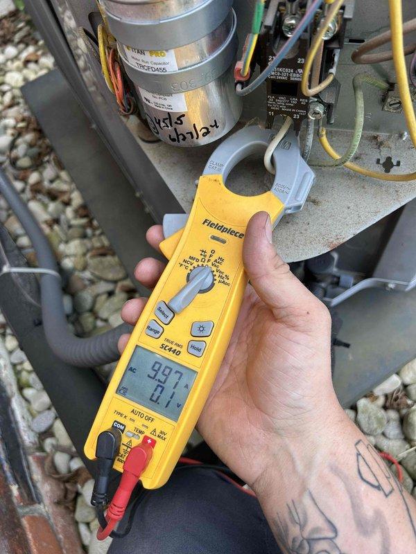 Completed routine AC tune-up on an eleven-year-old cooling system. Performed electrical diagnostics using clamp meter to verify proper amperage draw and system performance. Inspected outdoor condensing unit, capacitor dated from previous service, and all electrical connections. Indoor air handler located in upstairs bedroom is nine years old with customer-supplied filters. System operating within normal parameters with no repairs needed at this time.