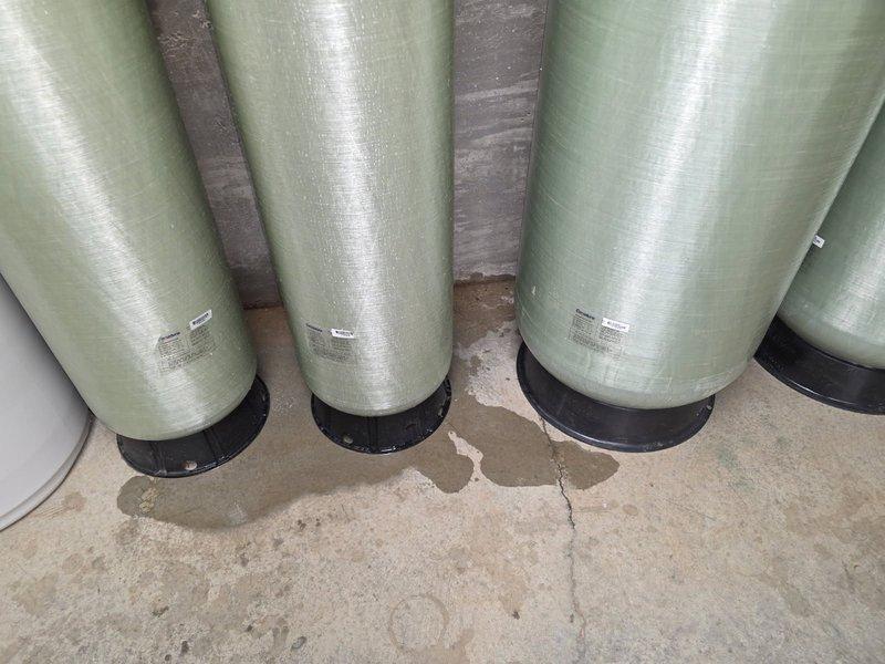 Completed bi-annual preventative maintenance service on commercial HVAC system consisting of 6 package units, 5 split geothermal units, 2 apartment geothermal split systems, and pool heater. Performed comprehensive cleaning and tune-up procedures on all equipment, inspected 6 model #800 steam humidifiers and 5 model #700 humidifiers, and documented filter requirements including various sizes of HVAC filters and humidifier pads. Verified pool heater belt specifications and assessed water treatment system components showing normal condensation patterns on storage tanks.