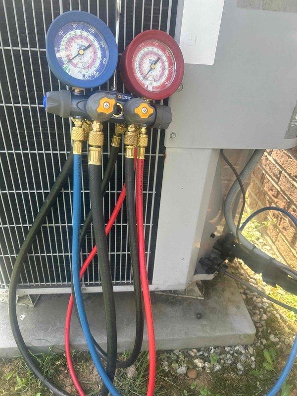 Responded to no cooling complaint on heat pump system with 5-degree temperature differential between setpoint and actual room temperature. Connected manifold gauge set to outdoor unit and performed refrigerant pressure diagnostics to evaluate system charge levels and determine cause of insufficient cooling capacity. Assessed condenser unit operation and electrical components during diagnostic process.