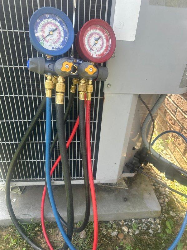 Responded to no cooling complaint on heat pump system with 5-degree temperature differential between setpoint and actual room temperature. Connected manifold gauge set to outdoor unit and performed refrigerant pressure diagnostics to evaluate system charge levels and determine cause of insufficient cooling capacity. Assessed condenser unit operation and electrical components during diagnostic process.