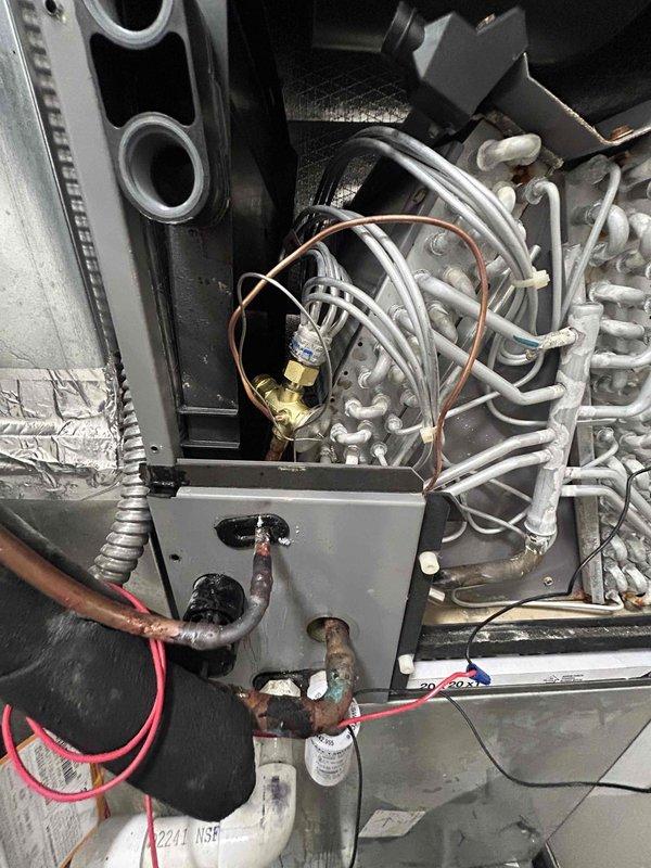 Replaced failed indoor thermal expansion valve (TXV) on HVAC system. Recovered approximately 11 pounds of refrigerant from the system prior to repair, recycled and returned it to the unit, and added 3-4 pounds of additional refrigerant to compensate for losses incurred during the repair process. Verified proper system operation and refrigerant charge upon completion.