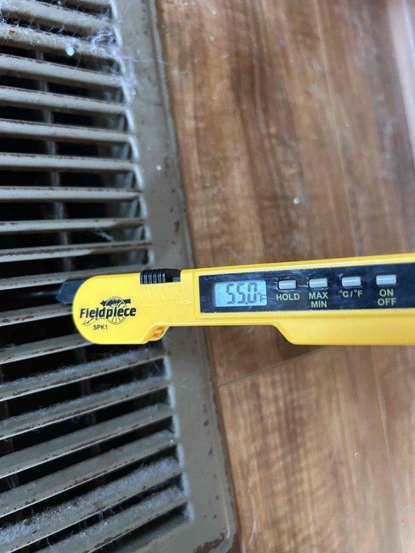 Responded to outdoor unit refrigerant leak. Located and repaired leak, evacuated system to proper vacuum levels, and recharged unit to manufacturer specifications. Verified system pressures and temperatures returned to normal operating range, with supply air temperature reading 55°F, confirming proper cooling operation restored.
