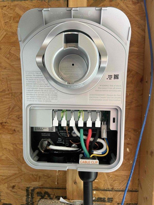 Installed a new dedicated 240V 50-amp circuit from the electrical panel to the garage location and mounted customer-supplied electric vehicle charging station on the garage wall. Completed all electrical connections per manufacturer specifications, verified proper grounding and polarity, and confirmed operational functionality of the charging unit.
