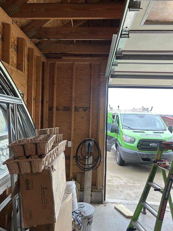 Installed a new dedicated 240V 50-amp circuit from the electrical panel to the garage location and mounted customer-supplied electric vehicle charging station on the garage wall. Completed all electrical connections per manufacturer specifications, verified proper grounding and polarity, and confirmed operational functionality of the charging unit.