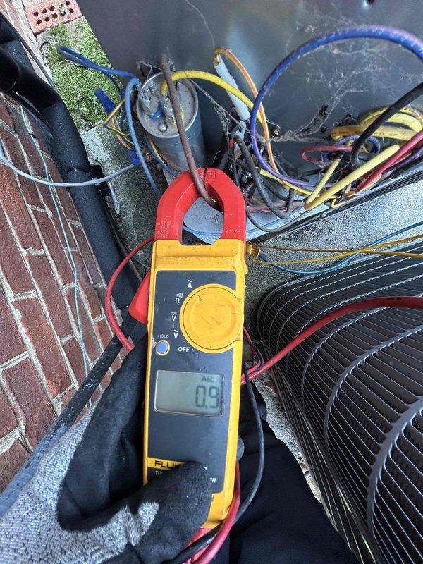 Completed comprehensive cooling maintenance on a 5-year-old Carrier air conditioning system that was operating properly. Performed full AC tune-up including electrical diagnostics with clamp meter showing 0.9 amp draw, temperature measurements at refrigerant lines reading 40.0°F at suction line, and thorough inspection of outdoor condenser unit. System check confirmed proper operation with all components functioning within normal parameters.