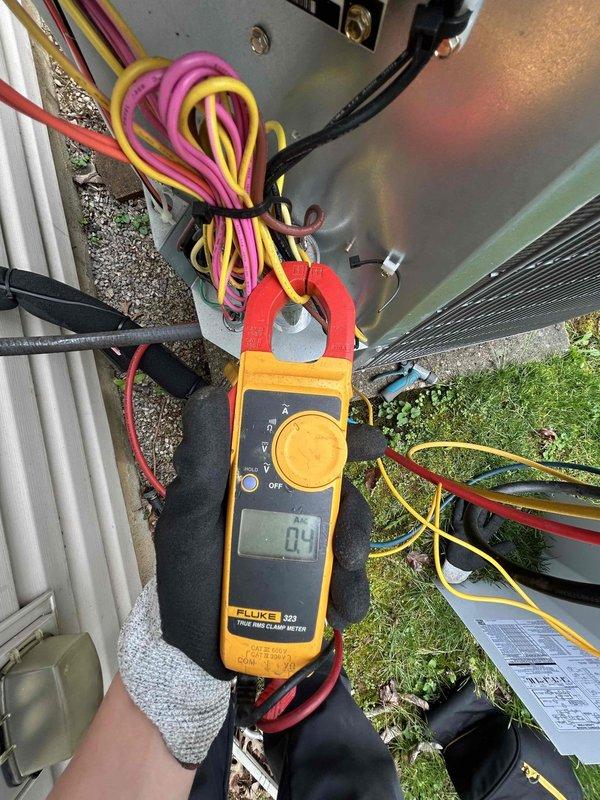 Completed comprehensive Care Plan tune-up on heat pump system with air handler located in attic accessible through garage. Performed electrical diagnostics on outdoor condensing unit using clamp meter to verify amperage draws and system performance, measuring compressor and fan motor current. Conducted refrigerant charge verification using digital scale to ensure proper system capacity. All components operating within manufacturer specifications at time of inspection.