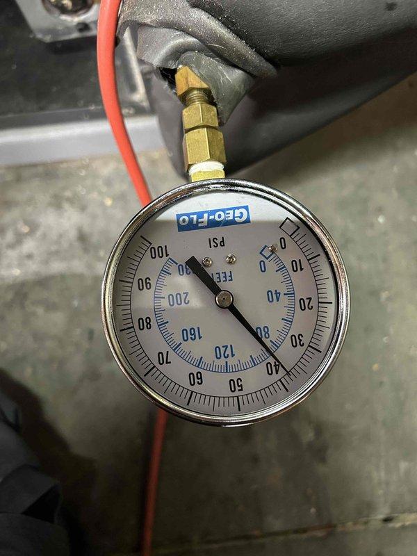 Performed comprehensive maintenance inspection on 10-year-old geothermal system with indoor unit located in walk-out basement for new homeowner. Conducted electrical diagnostics using multimeter to verify system operation, checked refrigerant pressures on geothermal loop system, and performed general cleaning and inspection of equipment. All system parameters found to be within normal operating range.