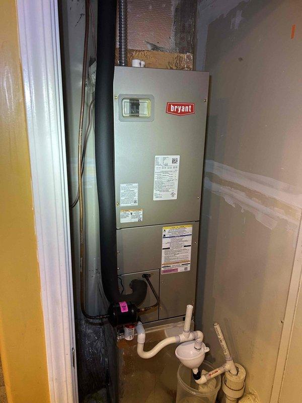 # HVAC Service Completed

Responded to no cooling complaint on 2-year-old Bryant air conditioning system covered under Greenbox warranty. Upon arrival, located air handler unit installed in utility closet with visible ductwork connections and condensate drainage system in place.

Performed diagnostic evaluation of system operation and airflow. Measured supply air temperature at air handler, recording 53.3°F at the supply plenum using calibrated digital thermometer. Inspected air handler cabinet, ductwork connections including silver flex ducting at supply, and black refrigerant line insulation. Verified condensate drain line configuration with white PVC piping and proper drainage routing.

Evaluated system components including blower operation, evaporator coil condition, and refrigerant line temperatures. Documented equipment nameplate data and warranty information from manufacturer labels on air handler cabinet. Assessed insulation integrity on refrigerant lines and ductwork, noting R
