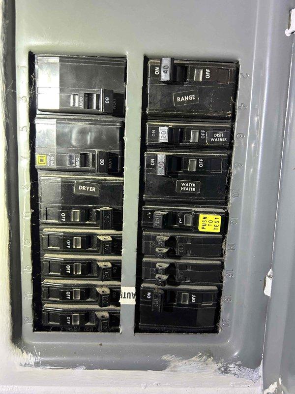 Responded to no cooling complaint on 8-year-old electric HVAC system with air handler located in attic. Upon arrival, performed diagnostic inspection of indoor unit and electrical panel to identify cause of system failure that began Friday. Documented existing equipment configuration including air handler, ductwork, and electrical connections through photo documentation. Noted missing air filter that was not available during previous November maintenance visit.