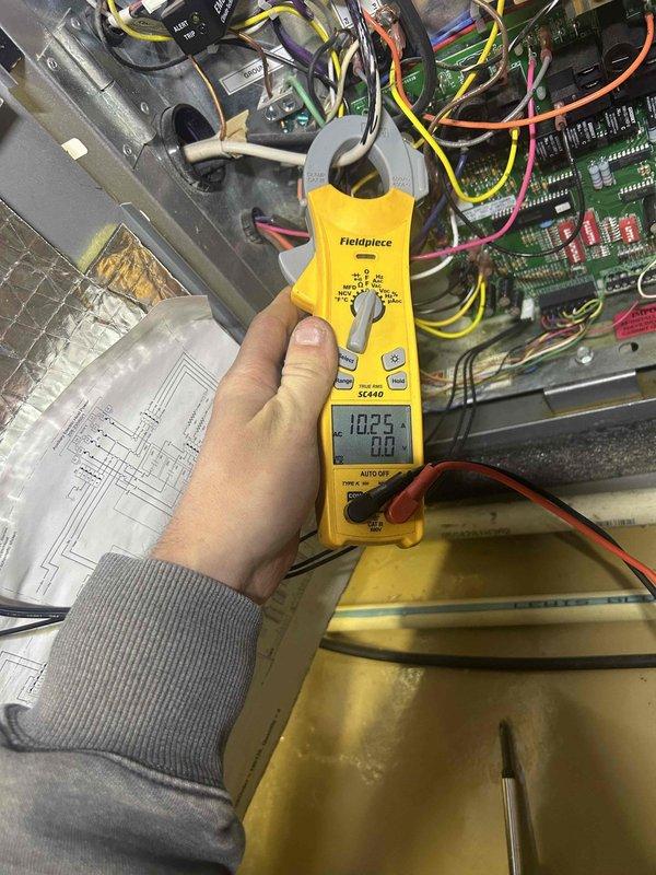 Completed comprehensive maintenance tune-up on geothermal HVAC system with humidifier located in basement. Performed thorough electrical diagnostics using clamp meter, verifying amperage draw at 102.5 amps and inspecting all control board connections and wiring harnesses to ensure proper operation. Measured system pressures using calibration gauges at brass valve manifold to confirm refrigerant charge and loop performance within manufacturer specifications. Verified all electrical connections were secure and properly seated, with special attention to ensuring no components were left disconnected. Customer provided replacement air filters and humidifier pad as requested for seasonal maintenance protocol.