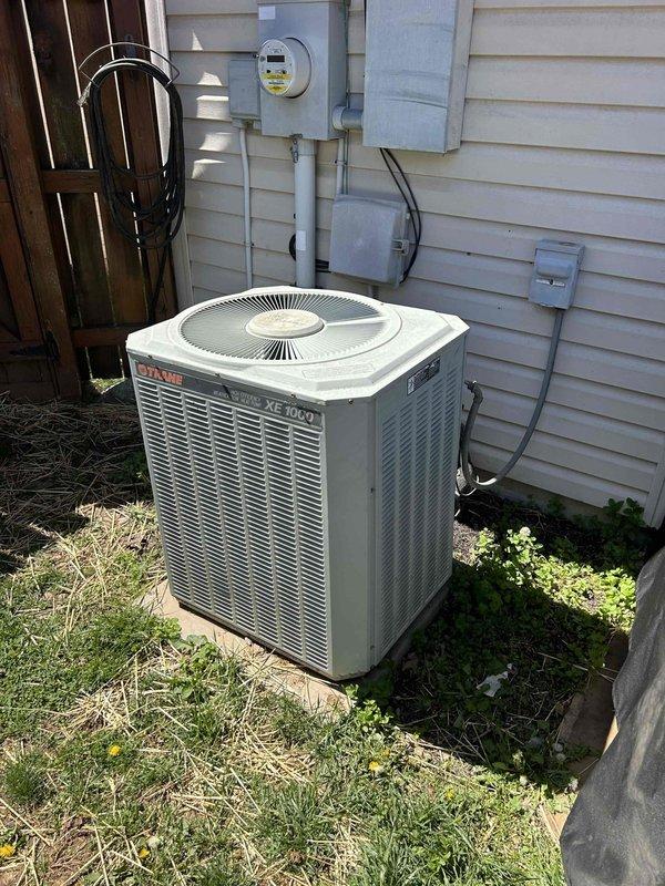 Responded to a no cooling complaint for a second opinion on a Trane XE 1000 split system previously diagnosed with compressor failure. Performed comprehensive diagnostic evaluation of the outdoor condensing unit, testing compressor electrical integrity including ohm readings for potential shorts or grounds to verify compressor condition. Inspected and tested run capacitor, contactor, and associated electrical components to rule out alternative failure causes. Confirmed compressor failure diagnosis and evaluated system age, refrigerant type, and overall equipment condition. Provided professional assessment regarding repair versus replacement options, taking into account the system's advanced age and cost-effectiveness of compressor replacement on legacy equipment. Documented indoor air handler condition and system configuration. Customer advised of findings and recommendations for next steps.
