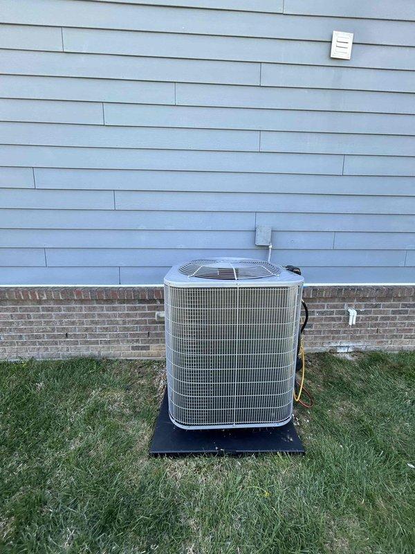 Completed full residential HVAC system installation including Bryant 2.5 ton 14.3 SEER2 heat pump (model GH5SAN53000A), Bryant air handler (model FJ5ANXB36L00) installed in attic space, and Bryant 10 KW heat kit (model TU-EC-10BKB). Positioned outdoor condenser unit on mounting pad with snow legs adjacent to home foundation, installed electrical disconnect box and whip kit with conduit run up exterior wall. Mounted air handler in attic with proper platform support over insulation, connected flexible ductwork to existing distribution system, and installed PVC condensate drain line with trap. Integrated existing thermostat with new system, installed insulated refrigerant lines between outdoor and indoor units, and added refrigerant line filter. Completed all electrical connections to code, obtained necessary permits, pressure tested refrigerant system, evacuated lines, charged system to manufacturer specifications, and verified proper operation of heating and cooling modes. Removed and d