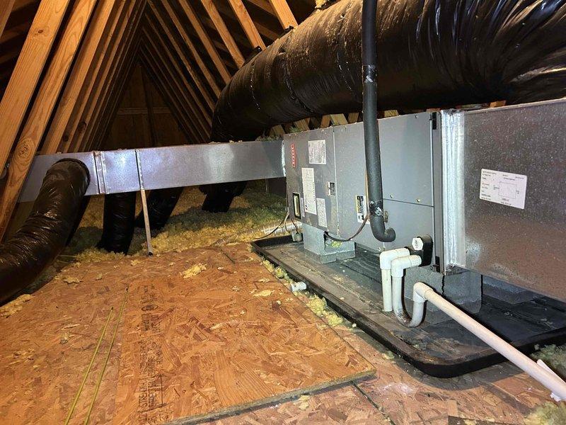 Responded to no-cooling complaint on 15-year-old upstairs electric air conditioning system maintaining 4 degrees above setpoint. Accessed attic-mounted air handler unit for diagnostic evaluation. Performed system inspection including airflow assessment, refrigerant charge verification, and component operational testing. Evaluated air handler, ductwork connections, and condensate drainage system. Inspected flexible duct runs and supply plenum connections for proper sealing and airflow distribution. Checked electrical connections, capacitor function, and blower motor operation. Assessed insulation levels and attic conditions affecting system performance. Provided customer with findings and recommended solutions to restore proper cooling capacity and temperature control for aging system.