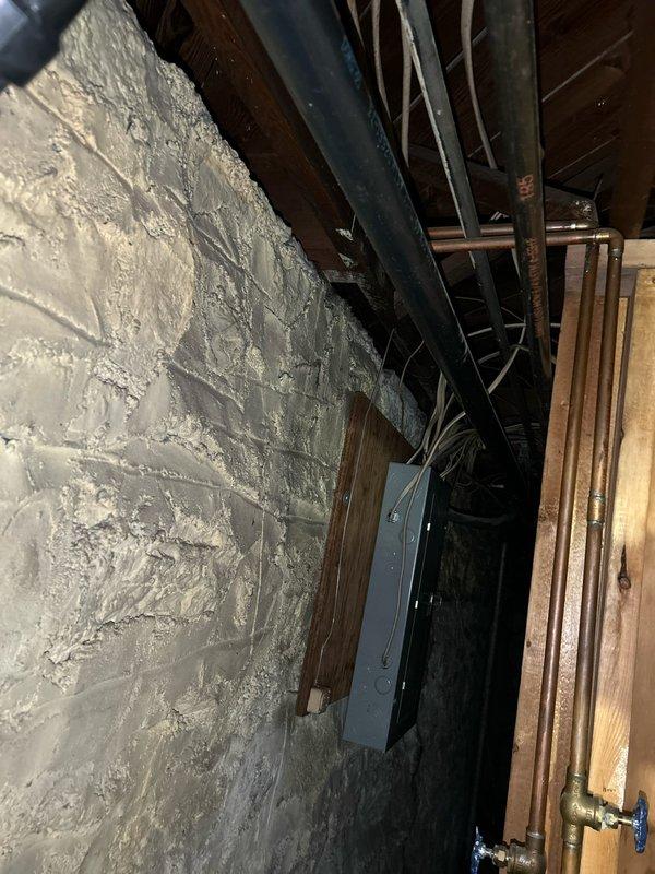 Responded to kitchen sink clog potentially originating from dishwasher connection. Upon inspection, accessed basement plumbing infrastructure beneath affected fixture and examined drainage system including black PVC vertical drain lines and associated horizontal waste piping. Verified proper venting configuration and assessed condition of drain connections at floor joist level where kitchen plumbing tie-ins are located.