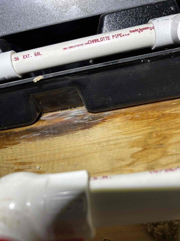 Responded to water leak from attic-mounted indoor unit that occurred after AC system resumed operation following storm outage. Found primary drain pan at capacity with visible water damage on ceiling below. Inspected condensate drain system and cleared clogged drain line obstruction. Verified proper drainage flow, tested system operation, and confirmed no additional leakage from unit.