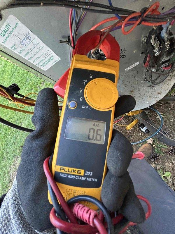 Completed Gold Level prepaid maintenance on single-system heat pump with air handler located in closet. Performed comprehensive system diagnostics including airflow measurements at floor register showing 46.1 CFM and electrical current draw testing at outdoor unit reading 0.6 AAC using clamp meter. Inspected all electrical connections, capacitor, and wiring at condensing unit, verified proper operation of all components, and documented system performance with photos per maintenance protocol.