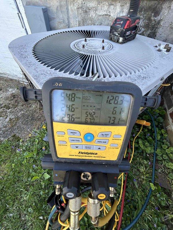 Completed annual care plan tune-up on residential heat pump system as part of first-year complimentary maintenance included with new installation. Performed comprehensive system diagnostics using calibrated digital manifold gauges and Fieldpiece meter, recording operating temperatures and pressures to verify proper refrigerant charge and system performance. Inspected outdoor condenser unit for proper operation, confirmed fan motor function, checked electrical connections at disconnect panel, and documented system readings showing satisfactory cooling performance with measured temperatures and superheat/subcooling values within manufacturer specifications.