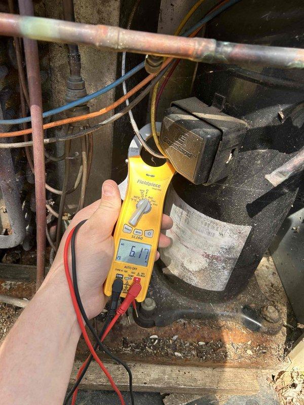 Completed preventative maintenance tune-up on air conditioning system with gas furnace located in hallway closet. Performed comprehensive system inspection including electrical testing with readings at 6.19 on compressor unit, verified thermostat operation at 68 degrees with proper fan auto mode functionality, and inspected all refrigerant lines and electrical connections. Customer provides their own filter for the system.