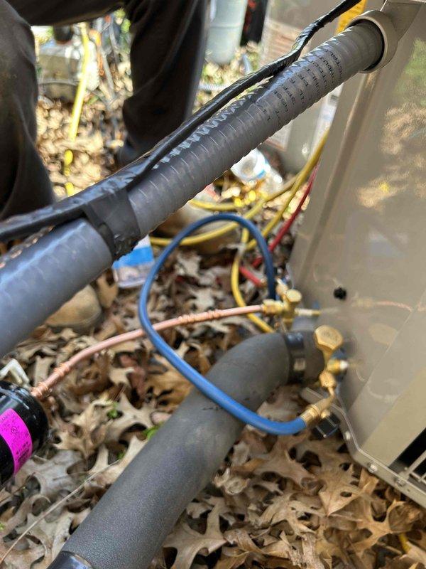 Completed full residential HVAC system installation including Carrier 16 SEER2 Comfort Series 4-ton heat pump (model 27SCA548A003), 4-ton air handler (model FJ5ANXC48L00), and 15KW heat kit (model AFAEHL15B01A). Installed digital thermostat, condensate pump with SS2 coil drain safety water sensor, ceiling saver overflow drain pan with water sensor, and standard air filter rack. Outdoor installation included new equipment pad with gravel base fill, snow legs, electrical whip kit, disconnect box, insulated refrigerant lines with filter, and all necessary brass fittings and service valves. Indoor air handler installation included trap, transition to existing ductwork, and proper drainage system. Pulled applicable permits, removed and disposed of existing equipment, and completed all electrical connections per code compliance standards.