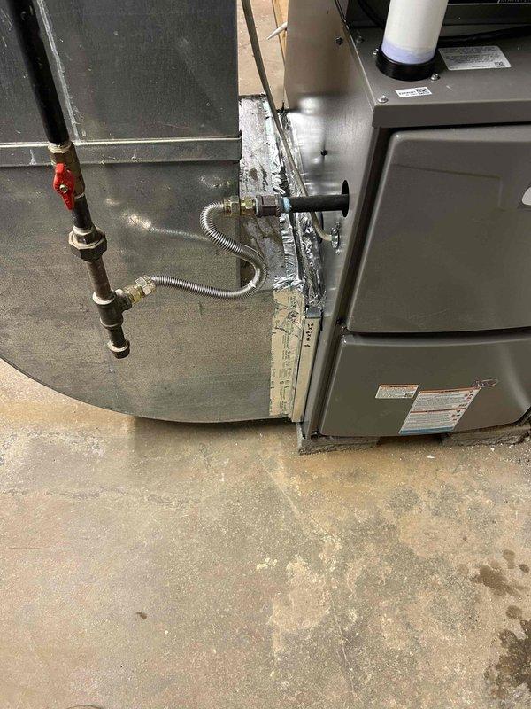 Completed full residential HVAC system replacement in basement location, installing Lennox ML193UH110XE48CK 93% AFUE 110,000 BTU gas furnace, Lennox ML14KC1-036-230 3-ton 16 SEER2 air conditioning unit, and Lennox CK40CT-48C-71 3-ton evaporator coil with digital thermostat. Removed and properly disposed of existing equipment per code requirements. Installed outdoor condensing unit on new equipment pad with electrical whip kit and disconnect box. Connected refrigerant lines with proper insulation and installed line filter drier. Installed evaporator coil with transition to existing ductwork and standard-sized air filter rack. Connected furnace to existing flue piping with proper venting, installed flexible gas line connector with gas shut-off valve, and verified flame roll-out protection. Installed electrical shut-off switches for both units. Ran and insulated refrigerant lines between indoor and outdoor components. Commissioned system including refrigerant charge verification, airflow 