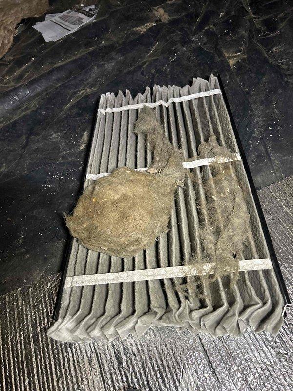 Completed annual Care Plan tune-up on air conditioning unit and gas furnace system located in crawlspace unit #413. Inspected and documented heavily soiled air filter showing significant dust and debris accumulation, which was noted as billable per service agreement. Performed temperature diagnostics using calibrated digital multimeter, recording operational reading of 46.38 degrees to verify proper system performance and cooling capacity.