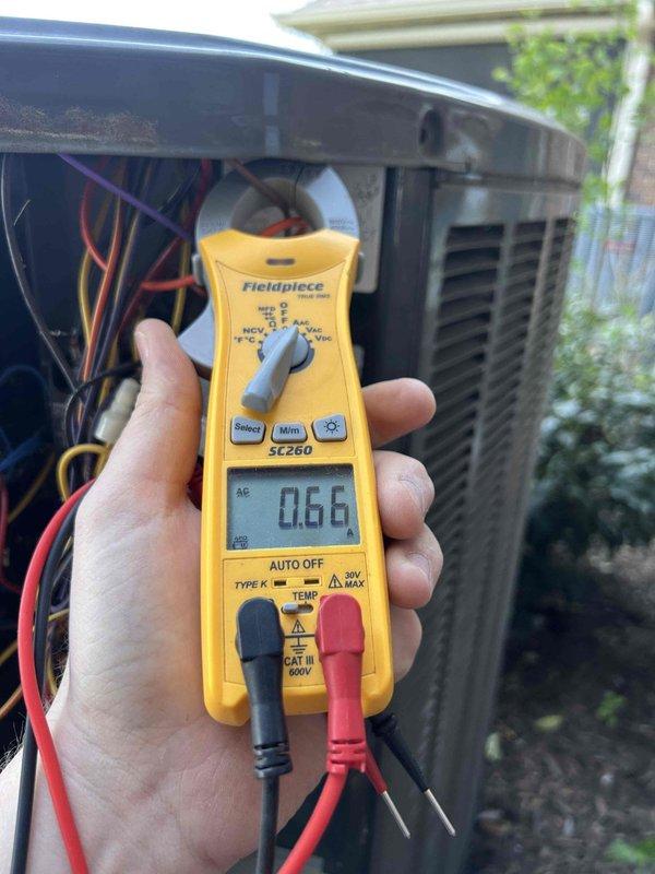 Completed comprehensive care plan tune-up on heat pump and air handler system located in attic space. Performed seasonal maintenance including switching damper positions at each multi-zone unit for optimal airflow distribution. Verified electrical performance using diagnostic meter, confirming proper amperage draw at outdoor condenser unit. Inspected evaporator coil assembly, noting V-configuration coil construction with clean aluminum fins and proper alignment throughout both sections.