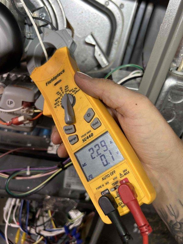 Completed scheduled HVAC maintenance on basement AC/gas furnace unit. Performed system diagnostics using digital multimeter, recording voltage readings of 229V and verifying electrical components operating within normal parameters. Measured supply air temperature at 43.3°F, confirming proper cooling performance. Inspected ductwork, gas line connections, and wiring harness for proper installation and secure connections. All system components found in satisfactory working condition. Customer provided 16x20x1 filter for installation.
