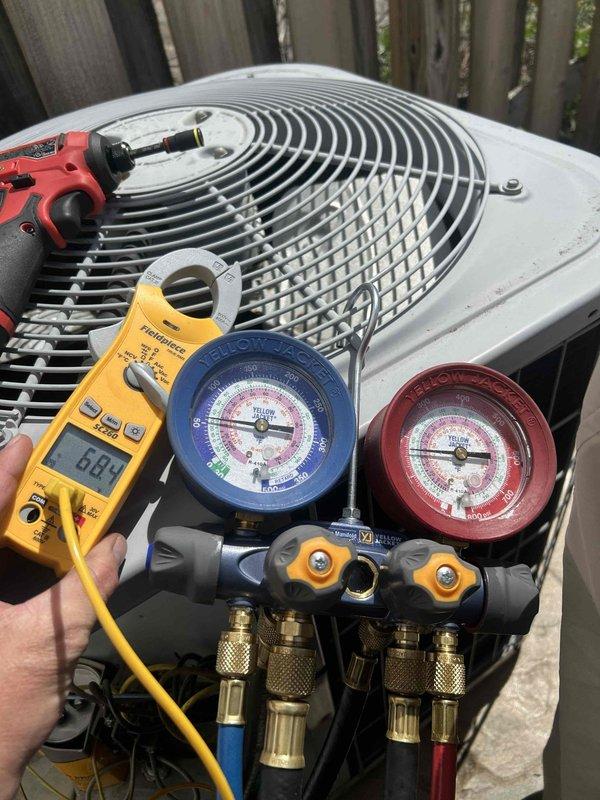 Completed seasonal maintenance tune-up on 14-year-old outdoor condensing unit and basement air handler system. Performed refrigerant pressure diagnostics using manifold gauges, recording system pressures and electrical readings with digital multimeter to verify proper operating parameters. All equipment inspected and tested, confirming system operational within manufacturer specifications.