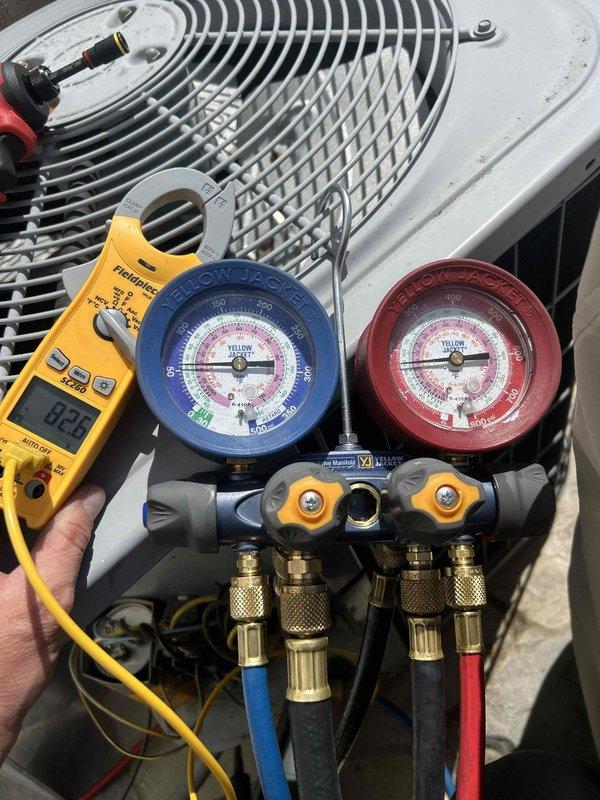 Completed seasonal maintenance tune-up on 14-year-old outdoor condensing unit and basement air handler system. Performed refrigerant pressure diagnostics using manifold gauges, recording system pressures and electrical readings with digital multimeter to verify proper operating parameters. All equipment inspected and tested, confirming system operational within manufacturer specifications.