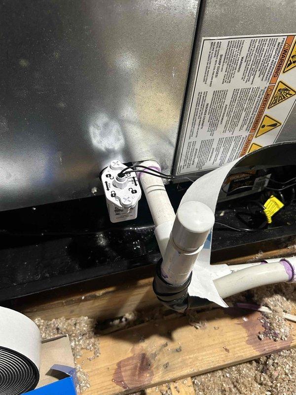 Responded to attic HVAC system experiencing drainage issues. Repaired and reconfigured condensate drain line with new PVC piping and fittings to ensure proper water evacuation from the unit. Installed drain pan beneath the equipment staging area to capture any overflow and prevent water damage to the wooden platform and surrounding structure. Verified proper drainage flow and secured all plumbing connections to prevent future leaks.