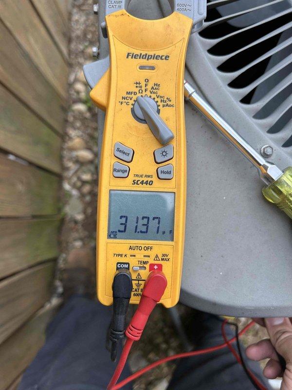 Completed maintenance tune-up on heat pump system for new homeowner. Performed comprehensive inspection of outdoor condenser unit and indoor air handler located in kitchen closet, documenting equipment condition with diagnostic measurements showing 31.37 amp draw. System had never been serviced prior to this visit.
